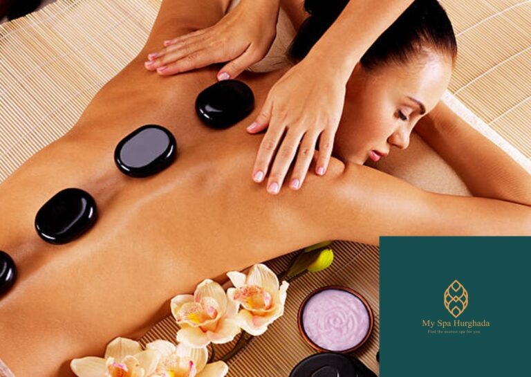 A serene woman enjoys a luxury Hot Stone Therapy session at a premium spa, while smooth black basalt stones sit along her spine next to beautiful white orchids.